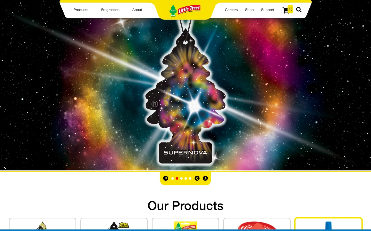 The Little Trees homepage: the Little Trees logo in a yellow header, a full-width Supernova fragrance hero showing a galaxy-patterned tree air freshener, and an Our Products row beneath it